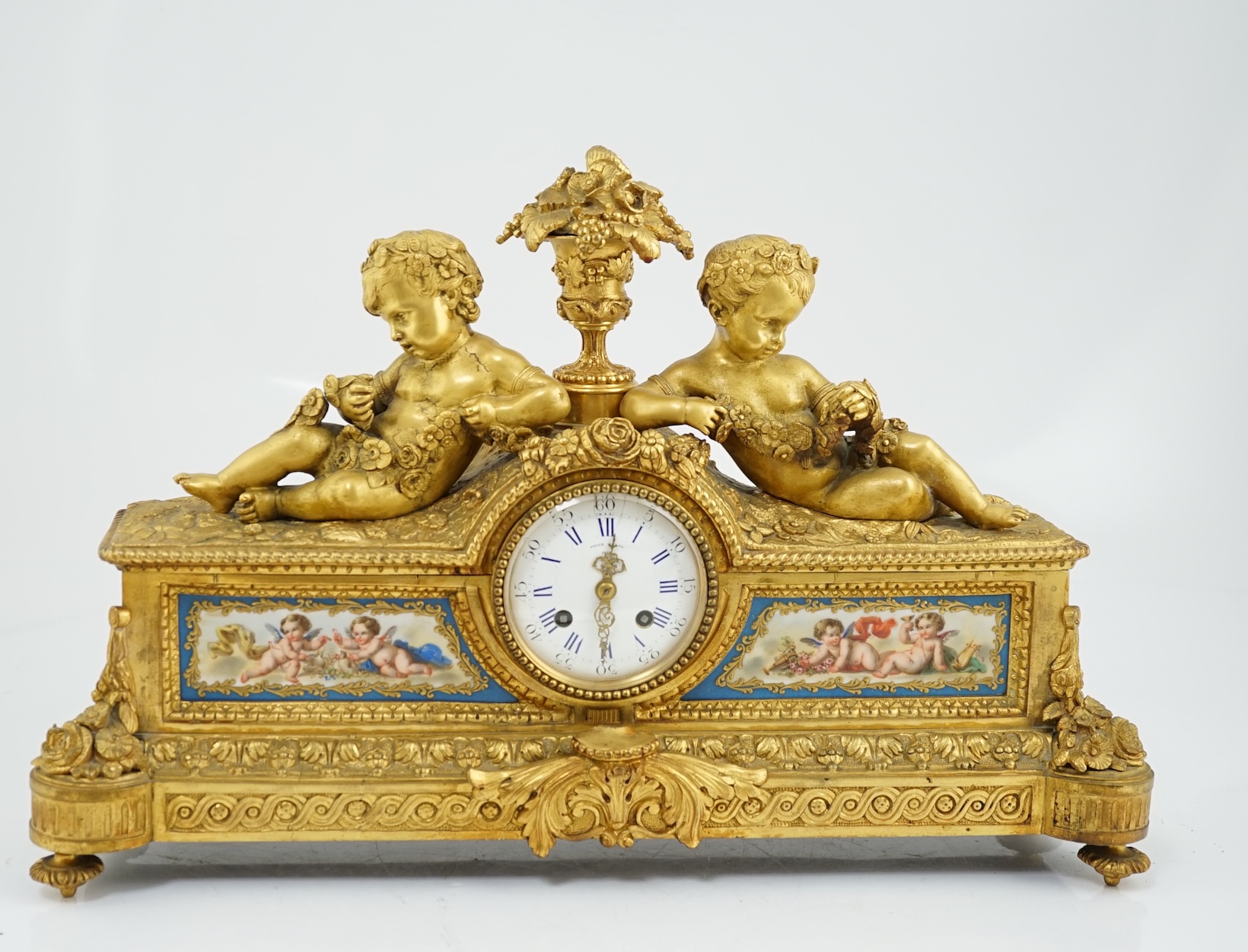 A 19th century French ormolu and Sevres style porcelain mantel clock